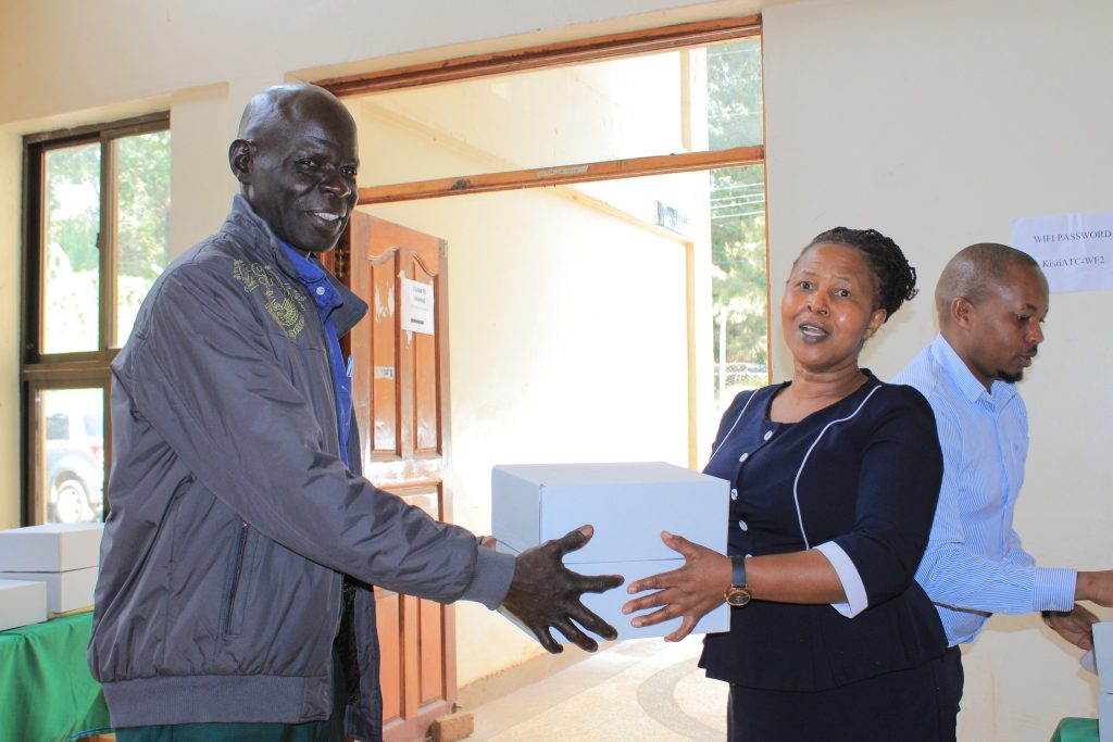 Chief Officer livestock issuing Soil testing kits to farmers.